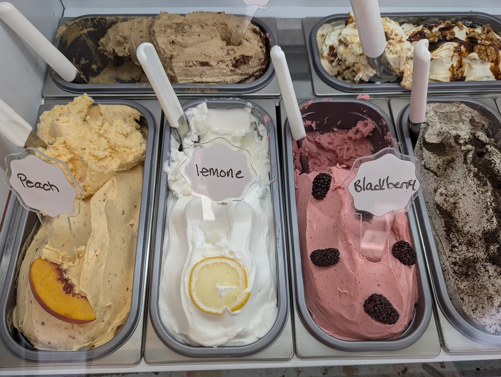 Trays of gelato in a shop case. The photo was not taken in Jupiter.