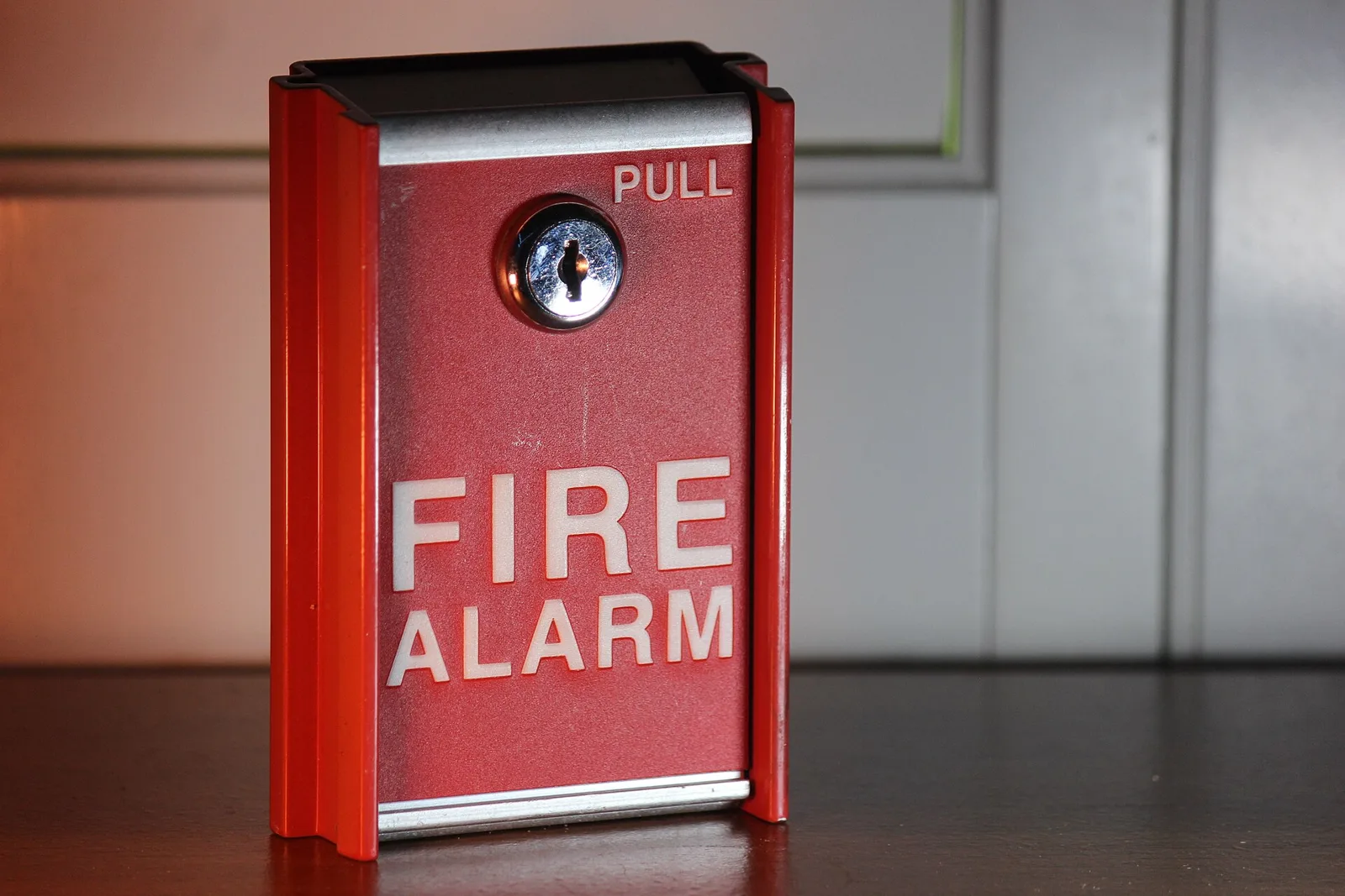 A fire alarm pull station.