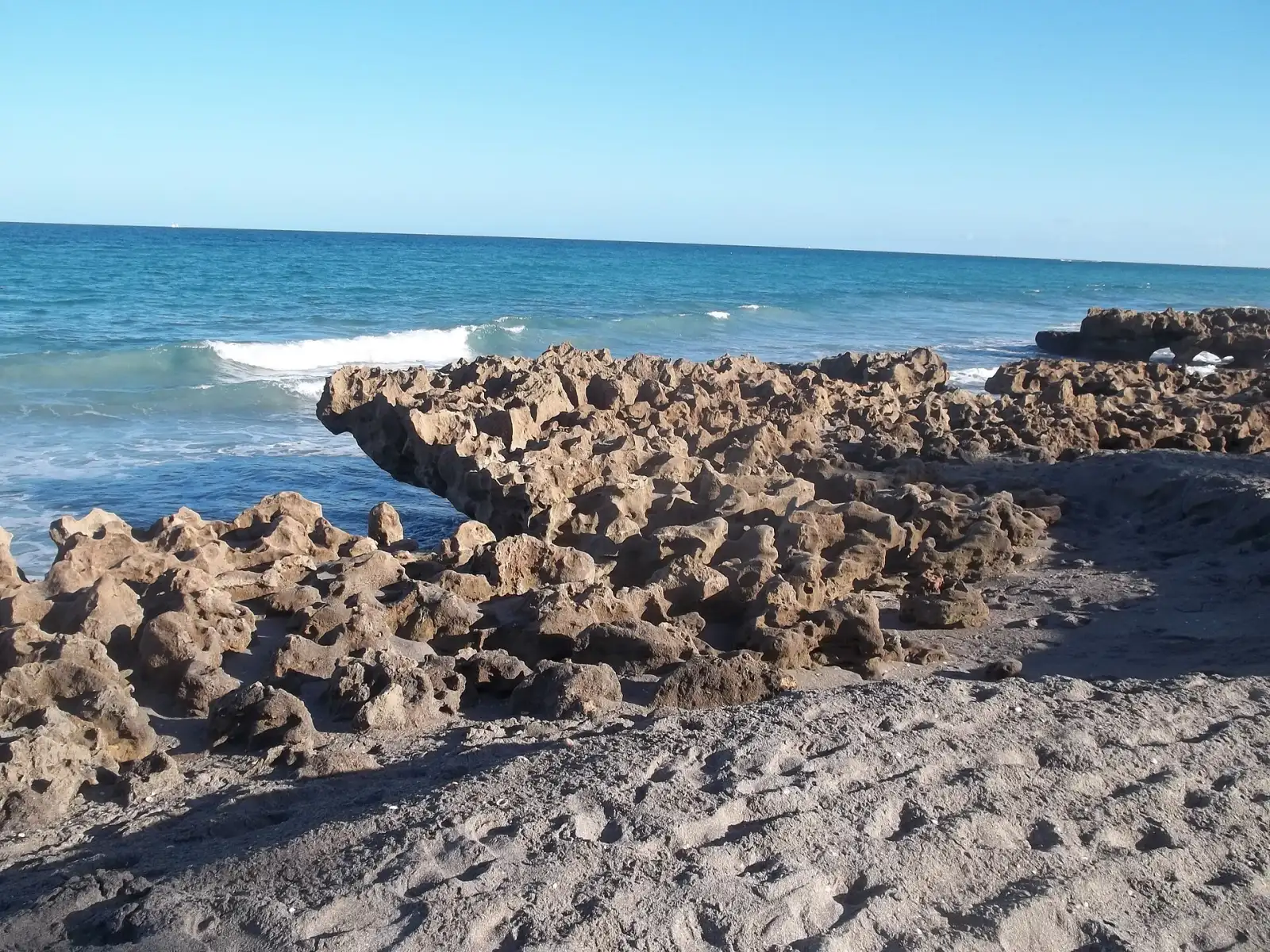 Limestone rocks along the shore at Coral Cove Park, north of the Jupiter Inlet.