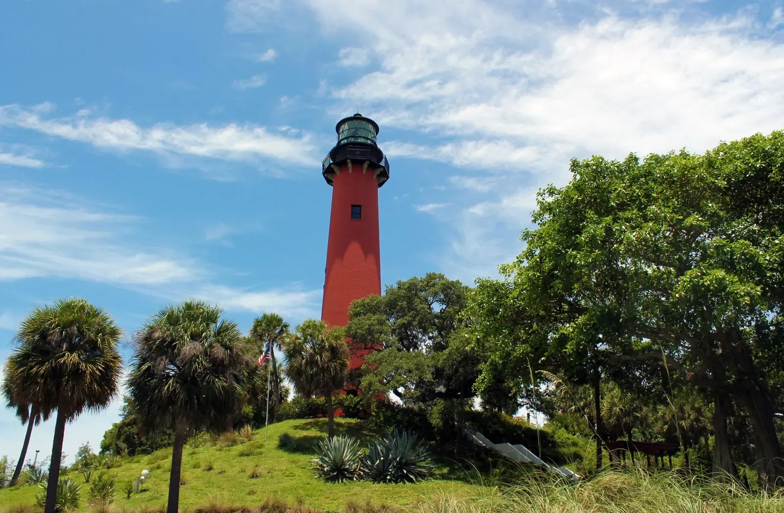 The Jupiter Inlet Lighthouse above the mangroves and the water of the Loxahatchee River.